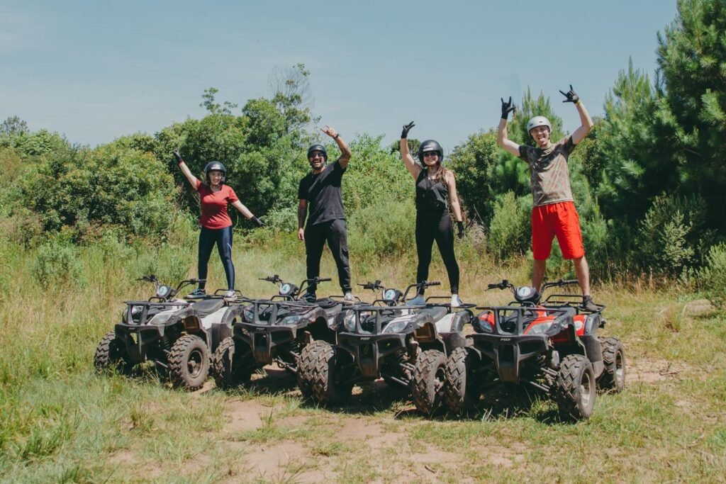 Four people enjoying a thrilling ATV ride in Quatro Barras, Brazil.